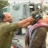 На видеозаписи, выложенной в сети организацией ISM, видно, как подполковник наносит удар своей винтовкой.