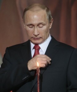 MOSCOW, RUSSIA. APRIL 12, 2015. Russia's president Vladimir Putin makes the sign of the Cross as he attends an Orthodox Easter liturgy at the Cathedral of Christ the Saviour. Mikhail Metzel/TASS Ðîññèÿ. Ìîñêâà. 14 àïðåëÿ. Ïåçèäåíò ÐÔ Âëàäèìèð Ïóòèí íà ïðàçäíè÷íîì ïàñõàëüíîì áîãîñëóæåíèè â õðàìå Õðèñòà Ñïàñèòåëÿ. Ìèõàèë Ìåòöåëü/ÒÀÑÑ