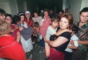 A group of women with their children remain in the corridors of the Budennovsk hospital 18 June 1995 during the spectacular and bloody hostage-taking by Chechen war lord Shamil Basayev in the southern town of Budennovsk. The hostage-taking which killed nearly 150 people in a Budennovsk hospital in June 1995 forced Moscow to start talks in the first conflict in Chechnya. Just before the collapse of the Soviet Union in 1991, Chechnya proclaimed independence and in 1992 separated from Ingushetia. The then Russian president Boris Yeltsin launched a military intervention in Chechnya in December 1994 which ended in 1996 with an accord that failed to address the region's final status. A new conflict erupted in October 1999 and has since left at least 4,500 Russian soldiers dead, according to official figures although other groups say the true number is closer to 13,000. There are in some 70,000 Russian soldiers based in the republic, while Moscow estimates the rebel forces at around 1,500 to 5,000. AFP PHOTO VLADIMIR MASHATIN