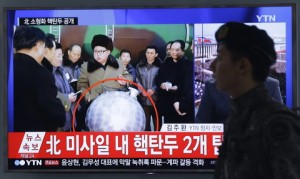 A South Korean army soldier walks by a TV screen showing North Korean leader Kim Jong Un with superimposed letters that read: "North Korea's nuclear warhead" during a news program at Seoul Railway Station in Seoul, South Korea, Wednesday, March 9, 2016. The official North Korean news agency says the communist country's leader Kim met his nuclear scientists for a briefing and declared he was greatly pleased that warheads had been miniaturized for use on ballistic missiles. (AP Photo/Ahn Young-joon)
