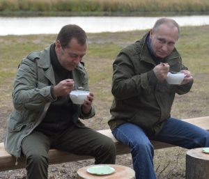 NOVGOROD REGION, RUSSIA - SEPTEMBER 10, 2016: Russia's Prime Minister Dmitry Medvedev (L) and Russia's President Vladimir Putin at Lake Ilmen. Alexei Druzhinin/Russian Presidential Press and Information Office/TASS Ðîññèÿ. Íîâãîðîäñêàÿ îáëàñòü. 10 ñåíòÿáðÿ 2016. Ïðåìüåð-ìèíèñòð ÐÔ Äìèòðèé Ìåäâåäåâ è ïðåçèäåíò ÐÔ Âëàäèìèð Ïóòèí (ñëåâà íàïðàâî) âî âðåìÿ îòäûõà íà áåðåãó îçåðà Èëüìåíü. Àëåêñåé Äðóæèíèí/ïðåññ-ñëóæáà ïðåçèäåíòà ÐÔ/ÒÀÑÑ