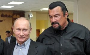 (FILES) This photo taken on March 13, 2013 shows Russia's President Vladimir Putin and American action movie actor Steven Seagal visiting a newly-built sports complex of Sambo-70 prominent wrestling school in Moscow. Hollywood tough guy Steven Seagal has had his blues gig cancelled at a festival in Estonia following an uproar in this formerly-Soviet ruled Baltic state over the star's pro-Russia views, the authorities said on July 29, 2014. AFP PHOTO/ RIA-NOVOSTI/ POOL / ALEXEI NIKOLSKY / AFP PHOTO / ALEXEI NIKOLSKY